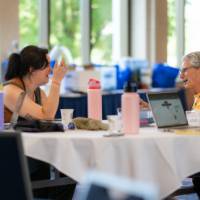 small group discussion at a professional learning, seated indoors